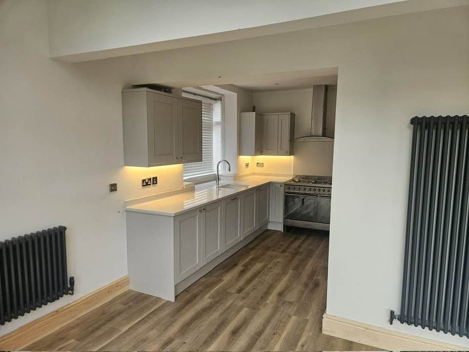 Grey shaker kitchen with quartz worktops and under-cabinet lighting